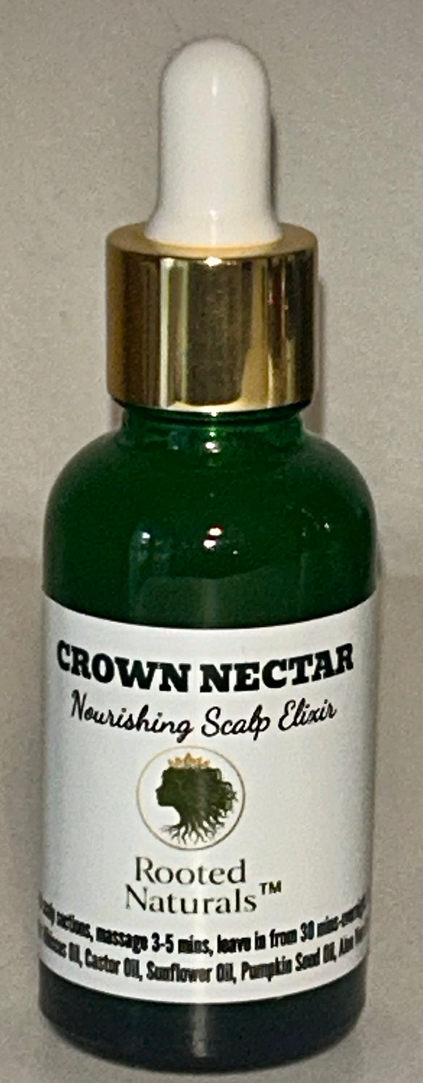 Rooted Naturals Crown Nectar Nourishing Scalp Elixir in a green glass dropper bottle